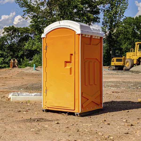 what is the cost difference between standard and deluxe portable restroom rentals in Spooner